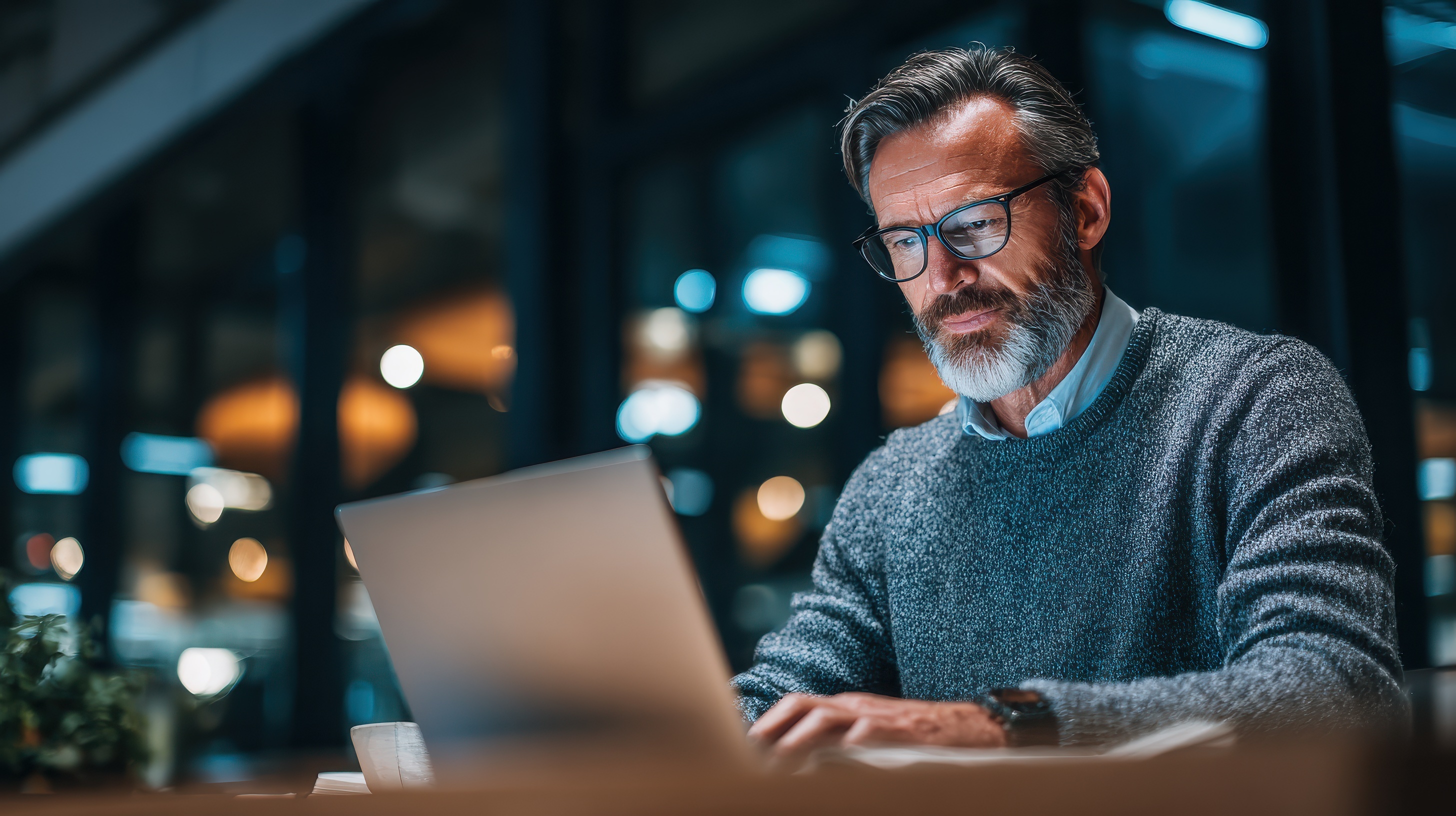 Mature business man executive manager looking at laptop computer watching online webinar training or having virtual meeting video conference taking notes, doing market research working in office., no logos, no brands --ar 16:9 --v 7 Job ID: f02f96c5-b654-4339-8690-b68fd2b9a276